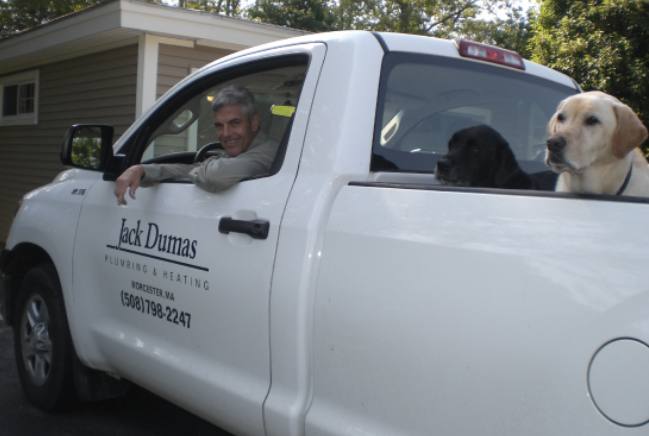 Jack Dumas in truck with dog